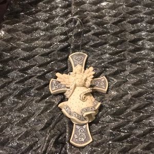 From Hallmark. Sarah’s Angel’s  Cross. With silver tie to hang it.